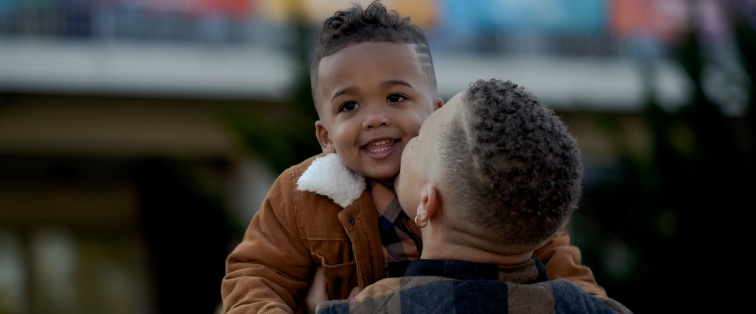 parent holding young child