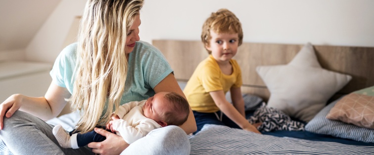 mother with a toddler and baby