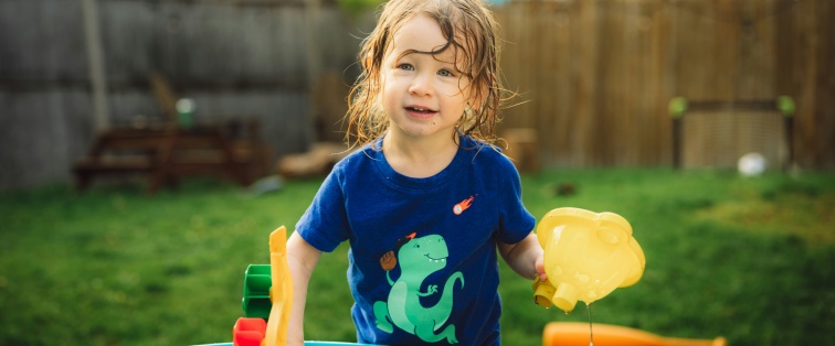 child playing outside in heat